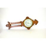 Carved oak aneroid barometer,