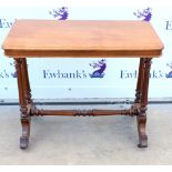 20th Century mahogany side table on turned supports and castors.89W X 73H X 48D