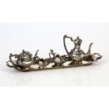 Miniature silver tea service on tray Birmingham 1905 comprising, tea pot, coffee pot, cream jug,