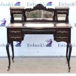 Writing desk with gallery top having bevelled glass mirrors, with a leather writing surface
