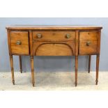 19th century mahogany bow-fronted sideboard with two central drawers flanked by cupboards, on turned