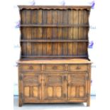 18th century style oak dresser, having three shelves above three short drawers and three floral