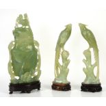 Chinese green stones, two birds and a jar and cover, in rectangular two blue fitted boxes