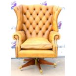 Yellow leather wingback swivel chair, Some slight lateral movement.Some minor marks and scratches to