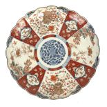 Large Chinese plate with scalloped edge in red and blue