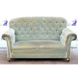 20th century button back two seater sofa, on bun feet and castors, H87 x W155 x D86cm