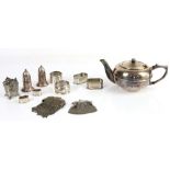 Selection of silver and plate to include a plated squat teapot, napkin rings, purses, flatware, etc