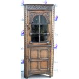 18th Century style oak corner cabinet with glazed door above cupboard. 76W X 182H X 45D General wear