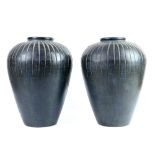 A pair of contemporary pottery jars of ovoid form with fluted decoration to top half, 43cm high