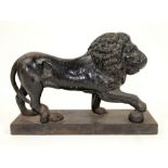 Victorian cast iron doorstop in the form of a lion with a paw on a ball Condition: heavily worn,