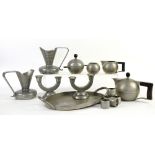 Group of silver items including a cigarette case, two napkin rings, filled dwarf candlesticks and