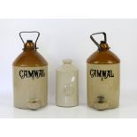 Two stoneware cider jars, marked Camwal, both with stoppers and metal swing handles, one H.35cm (