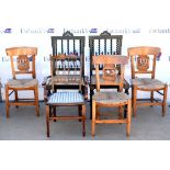 A pair of black painted chairs with barley twist backrests and rattan seats, together with three