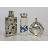 Three silver small scent bottles in a variety of designs