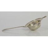 Silver tea strainer by Wakeley and Wheeler London 1925