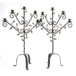 A pair of contemporary metal 5 branch candelabra with entwined leaf detail 73cm high and a 7