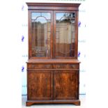 Early 20th century reproduction inlaid mahogany bookcase, dentil cornice above astragal glazed