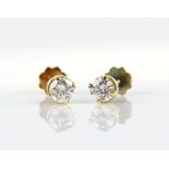 A pair of single stone diamond stud earrings, round brilliant cut diamonds, weighing an estimated