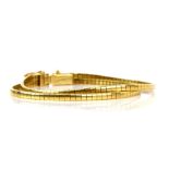 Modern Italian gold bracelet; double omega link gold bracelet stamped 18 ct, with makers mark FOT,