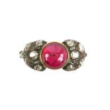 Old cut diamond and synthetic ruby ring; featuring a central circular cabochon cut synthetic ruby,