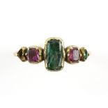 Antique ring, set with central rectangular cut emerald, with rubies and triangular cut emerald set