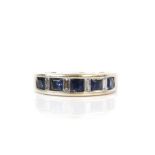 Sapphire and diamond band ring comprising five square step-cut sapphires alternated with four