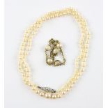 Single row graduated pearl necklace, strung with knots, clasp set with a single transitional cut