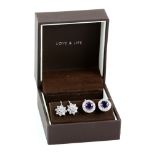 Two pairs of screw back earrings, comprising a pair of diamond daisy clusters, round brilliant cut