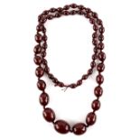 1920's graduated Bakelite necklace, largest oval bead measuring 2.4 x 1.8 cm, strung with knots,