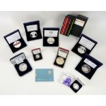A collection of seven 5 ounce silver proof coins and other silver collectibles comprising the Edward