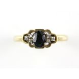 Modern sapphire and diamond ring, central oval cut blue sapphire, estimated weight 0.75 carats,
