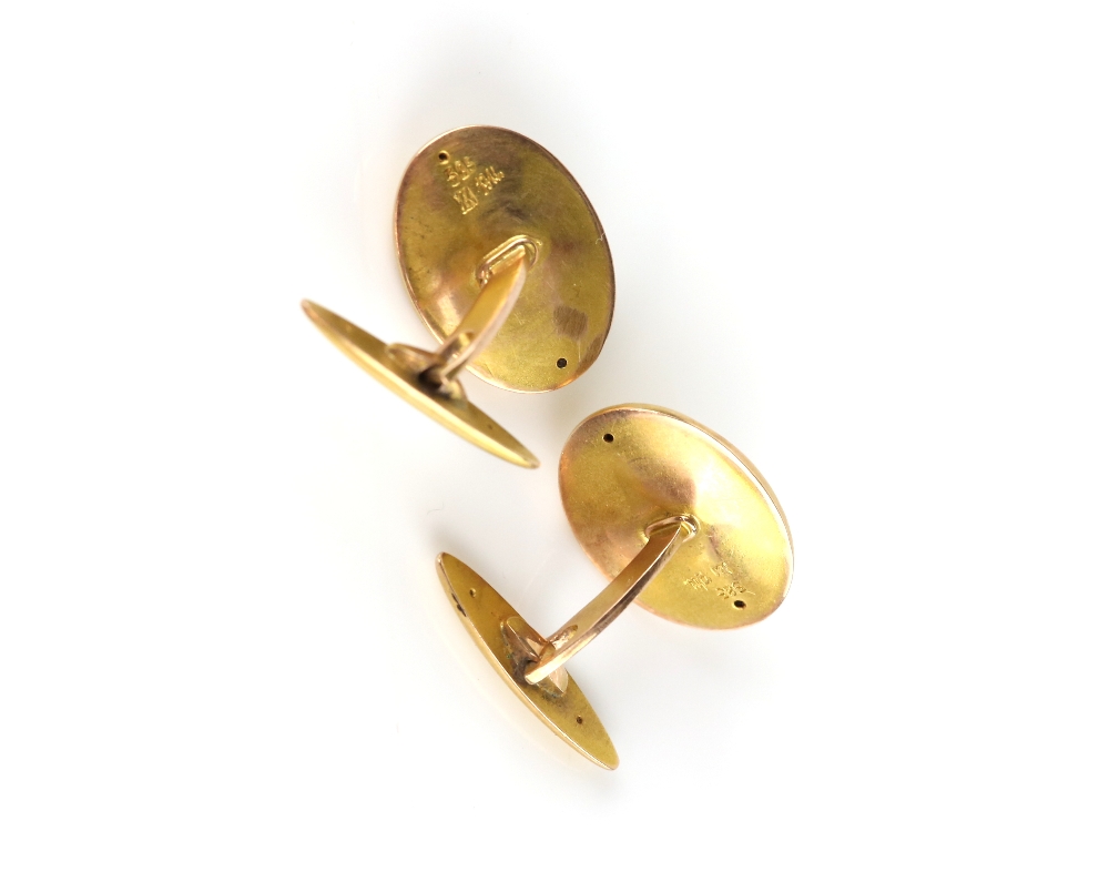 20th century oval cufflinks, each set with an off-centre cabochon sapphire to a panelled design, - Image 2 of 2