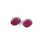 Two loose oval cut rubies, one with an estimated weight of 6.61 carats and another similar at 5.85