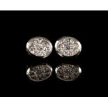 Pair of contemporary diamond oval cluster earrings, designed by Abel Fabri from Okidanokh Goldcraft,