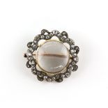 Old cut diamond brooch, central double sided glazed locket panel, surrounded by old cut diamond