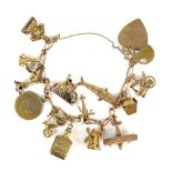 Vintage charm bracelet with fifteen charms, including a scooter charm testing as 18 ct, Scottish