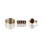 Three garnet rings, comprising a garnet and diamond half hoop ring, set with ten oval cut garnets,