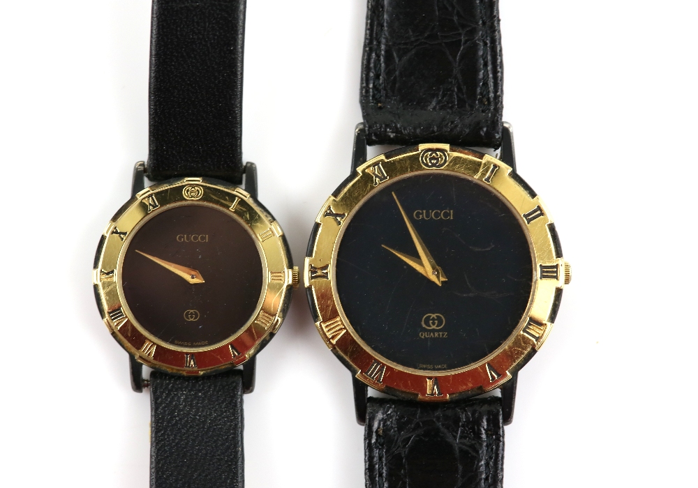Gucci gentleman's reference 3200 wristwatch with black dial, and a ladies 3200L wristwatch, the gilt