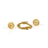 Indian style circular openwork gold earrings testing as 18 ct and fine twisted link chain, chain and