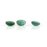 Three oval cut loose emeralds, one with an estimated weight 2.95 carats, another 2.26 carats and 2.
