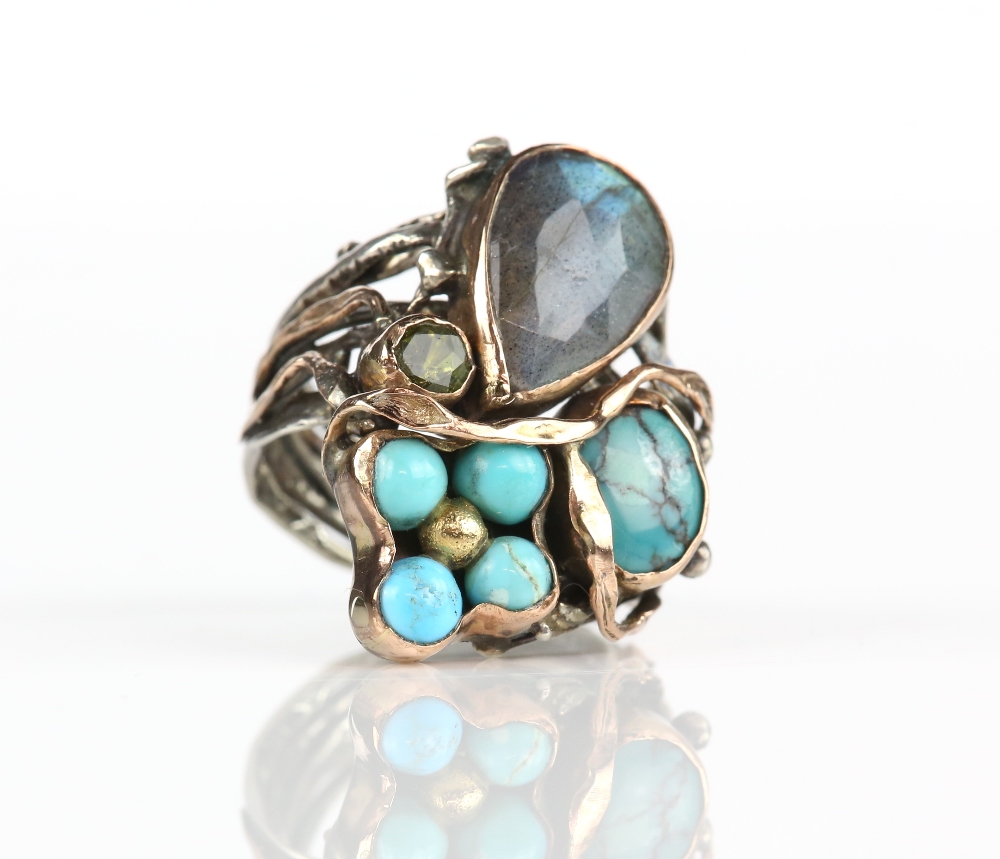 Italian abstract gem set ring, with a pear cut labradorite, round cut peridot and turquoise, mounted