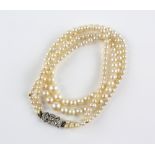 Graduated double row pearl necklace, with old cut and Swiss cut diamond set clasp, 44cm in length