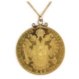 1915 Austrian gold 4 Ducat coin set as a pendant, on a curb link chain testing as 9 ct, 86.5cm in