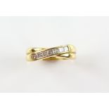 Modern diamond crossover half eternity ring, seven princess cut diamonds, weighing an estimated