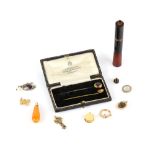 A selection of antique and vintage items including a stick pin featuring a ladies profile testing as