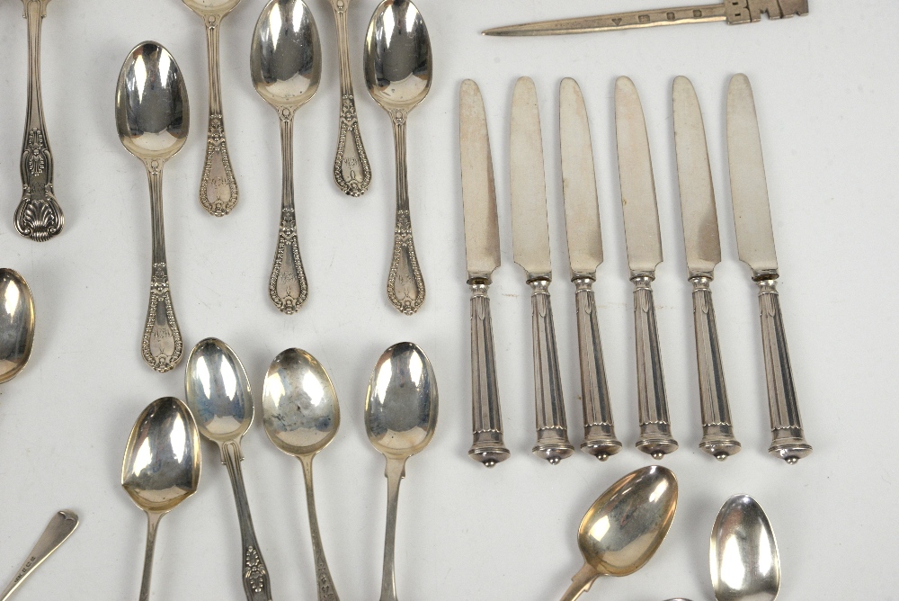 Large group of silver teaspoons and other items, including butter knives, caddy spoons, sugar - Image 7 of 10