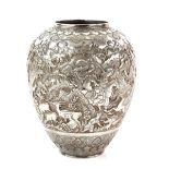 Persian silver vase, the ovoid body chased in high relief with a hunting scene, 21.5 cm high, 33.5