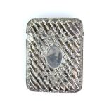 Art Nouveau cross banded silver vesta case with two vacant cartouches and a climbing rose or