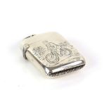 Engraved Victorian silver vesta case with a scene of a man riding a bicycle, with a fence tree and