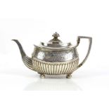 George III silver teapot, the fluted compressed oval body engraved with a band of acorns, flowers